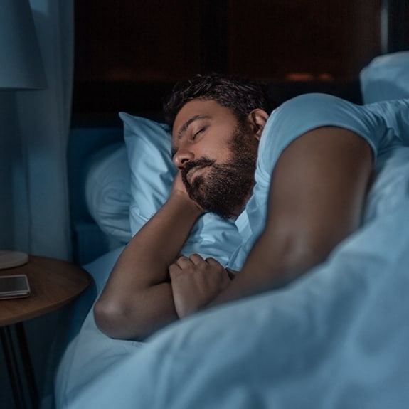Person sleeping in bed