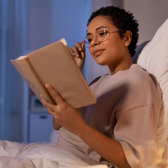 Person reading in bed