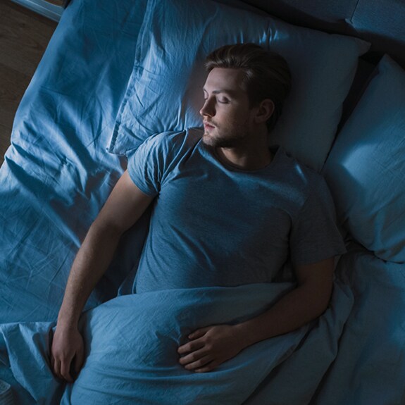 Person asleep in bed