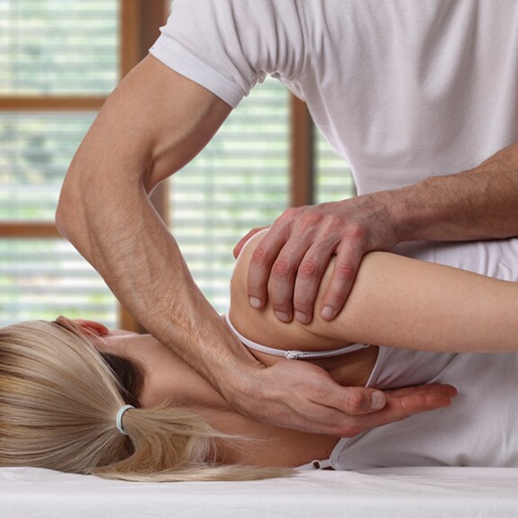 Person laying down getting back adjustment