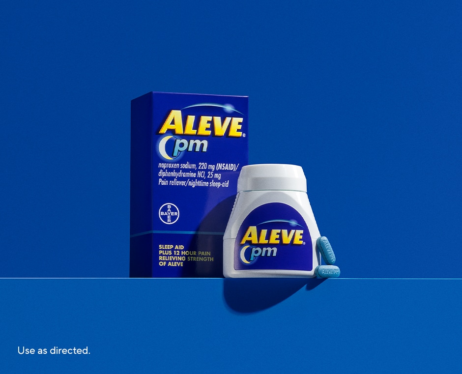 blue background with packages of Aleve® PM 